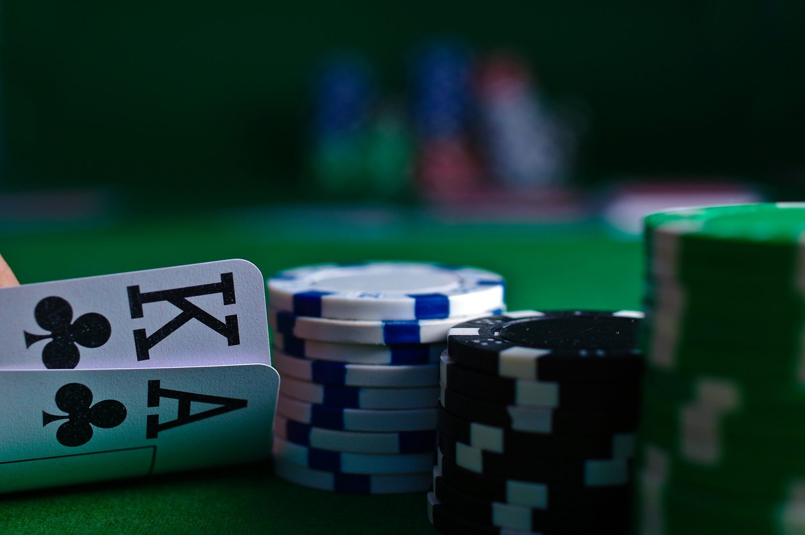 white and black dice on green table